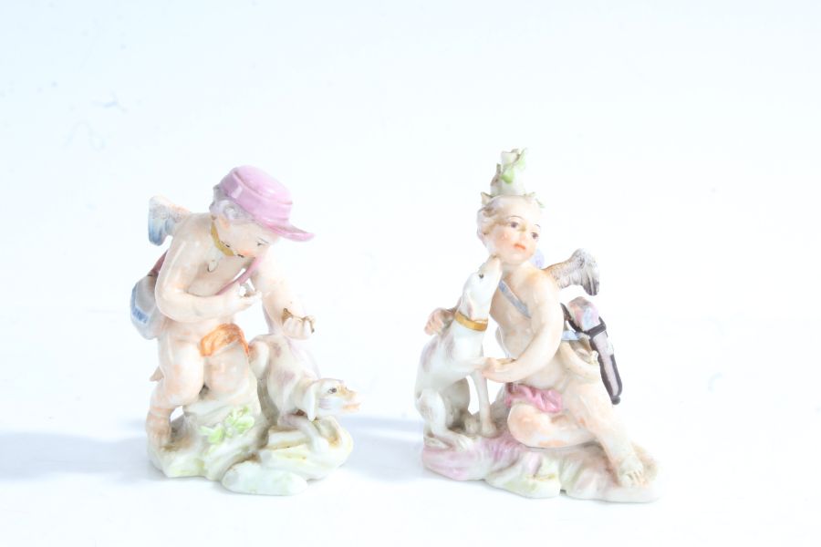 Two figures, possibly Ludwigsburg, modelled as two cherubs with dogs, the tallest 6.5cm high (AF)