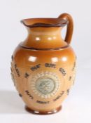 Doulton Lambeth stoneware jug, applied with four cameos of figure heads and surrounded by text "He