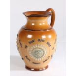 Doulton Lambeth stoneware jug, applied with four cameos of figure heads and surrounded by text "He