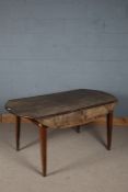 Large rustic style oak drop leaf table, the oval top raised on tapering square legs, 149cm wide 74cm