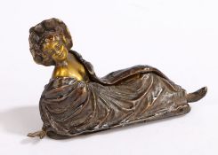 Art Nouveau style cold painted bronze depicting a reclining scantily clad lady enclosed by a