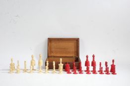 19th Century English bone chess set, with turned pieces, red and natural, the kings 10cm high