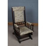 Victorian mahogany and upholstered American rocking chair, decorated with floral upholstery and