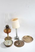 Silver plated corinthian column table lamp, together with an oil lamp, brass cased aneroid