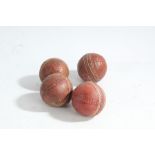 Collection of four cricket balls, red leather and strung, (4)