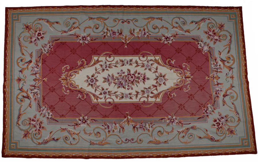 Aubusson style wool carpet, the central cream field with pink and red roses surrounded by flower