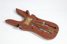 Pair of early 20th Century cased boot pulls, the case to form the boot jack with steel pulls inside