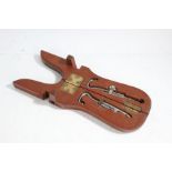 Pair of early 20th Century cased boot pulls, the case to form the boot jack with steel pulls inside