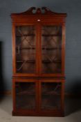 Sheraton Revival mahogany and marquetry inlaid bookcase, with a scroll carved pediment with a