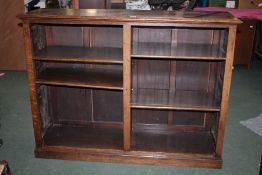 20th century oak open bookcase, the rectangular top above a open storage compartment with four