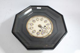 Victorian ebonised octagonal wall clock, having alabaster face with blue and white enamelled roman