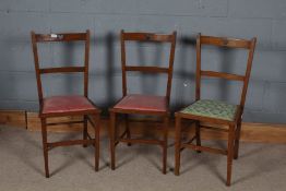 Set of three 20th century bedroom chairs, with a heart carved out of the cresting rail, set on