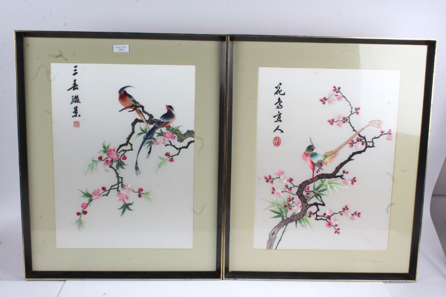 Pair of 20th century Chinese silk works both depicting exotic birds on a cherry blossom branch, both