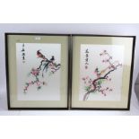 Pair of 20th century Chinese silk works both depicting exotic birds on a cherry blossom branch, both
