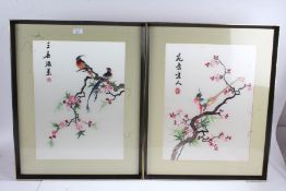 Pair of 20th century Chinese silk works both depicting exotic birds on a cherry blossom branch, both