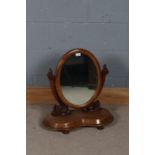 Victorian mahogany dressing table mirror, the oval mirror together with a pair of floral supports,