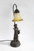 Art Nouveau style bronzed figural table lamp, in the form of a girl holding a basket of flowers,