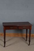 Victorian mahogany side table, the rectangular top above two drawers with moulded frieze raised on