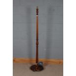 20th century mahogany standard lamp, with a turned column on a circular base, 159cm high