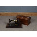 Jones Family C.S. sewing machine together with carrying case