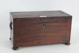 19th century mahogany tea caddy, the rectangular top opening to reveal three compartments, raised on