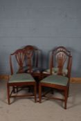 Set of four 19th century Hepplewhite vase back dining chairs, with an arched cresting rail above a