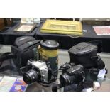 Vivitar 72mm camera lens, together with a Minolta Dynax 500si camera, and a Fujifilm S4500 camera,