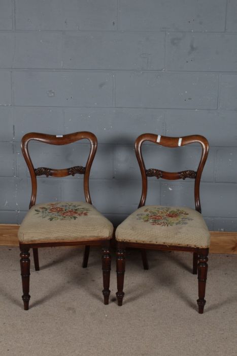 Pair of 19th century chairs, the wavy cresting rail above a scroll carve splat, set on a floral