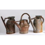 Collection of three 19th Century watering cans, to include a near pair and one with a bulbous