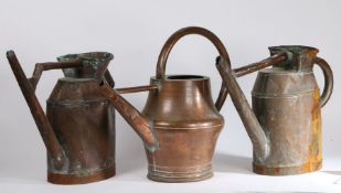 Collection of three 19th Century watering cans, to include a near pair and one with a bulbous