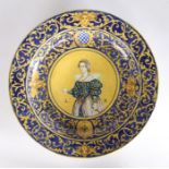 Italian majolica charger, decorated with a central lady and the initials LB with a blue and yellow