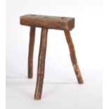 Primitive 20th Century oak stool, the rectangular seat above three legs formed from branches, 36cm