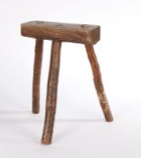 Primitive 20th Century oak stool, the rectangular seat above three legs formed from branches, 36cm