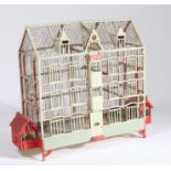 Early 20th Century French birdcage, the painted cage formed of three floors, 65cm wide, 55cm high