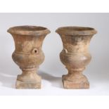 Pair of mid 19th Century terracotta urns, of classical urn form on plinth bases, 57cm high, (2)