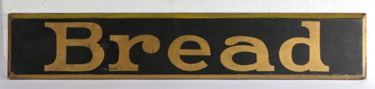 Ebonised advertising panel with gilt lettering "Bread", with bevelled gilt painted border, 90cm