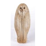 Primitive carved decoy owl, with bead eyes and a shaped body, 29cm high