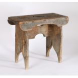 19th Century stool, the rectangular lid with pierced top above arched supports, 50cm wide, 27cm