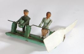 Swedish whirly gig, circa 1940, with two figures on a green painted frame, 42cm long