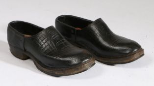 Pair of leather and wood display clogs, 29cm long (2)