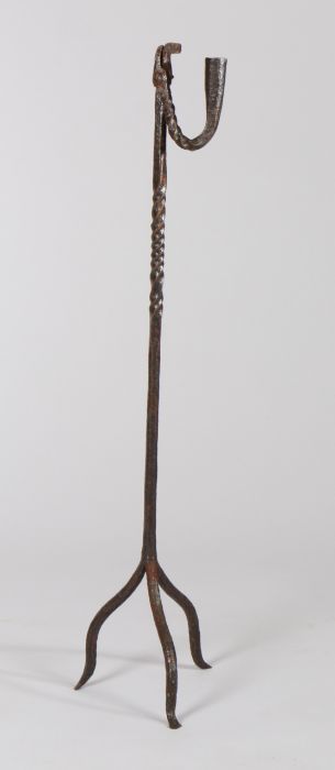 18th Century iron peerman, with candle sconce and rush light holder, on a twisted stem and tripod