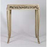 Carved wood and marble topped side table, the rectangular top with rounded corners above a carved