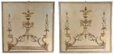 Pair of French wooden and gilded panels, centred with gilt urns and lion masks within a beaded