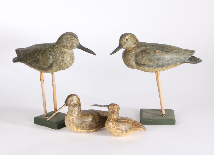 Collection of four decoy birds, two raised on stands and two without, 25cm long to 17cm long, (4)