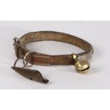 Early 20th Century dog collar and whistle, the leather collar with brass bell and a whistle carved
