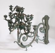 19th Century bronze wall mounted chandelier, of large proportions, the pierced scroll cast wall