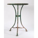 Late 19th Century painted metal French bistro table, the circular top showing layers of red and