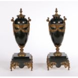 Pair of Victorian black slate garnitures, with gilt metal mounted garlands. 40cm tall (2)