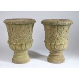 Large pair of stone garden urns, with a lappet edge and carved scroll body above the stepped