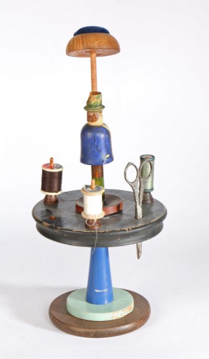 Novelty sewing set, France circa 1950, carved with a figure above the stand, 40cm high